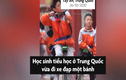 Video  Học sinh tiểu học ở Trung Quốc bắn cung trên xe một bánh