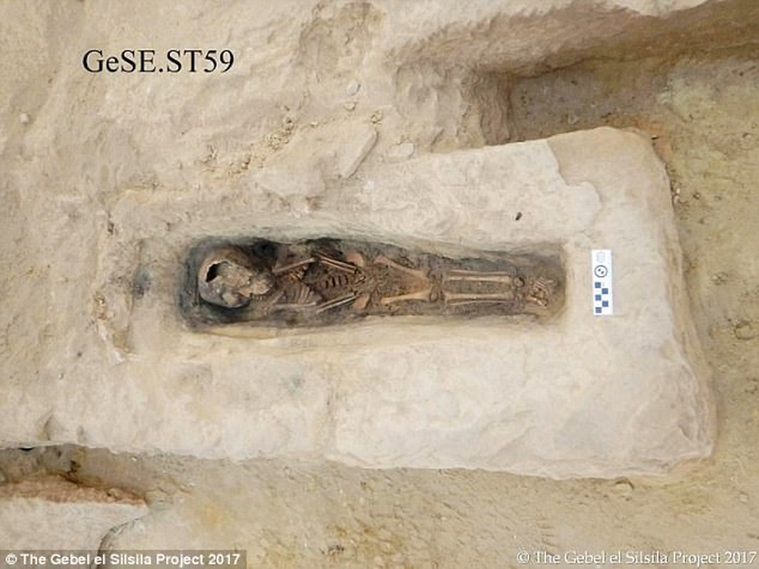 One of the burials contains the remains of a child aged just 2-3 years old (pictured) at the time of death. The toddler was found surrounded by rocks, with bits of the linen wrappings and organic material from the wooden coffin still remaining