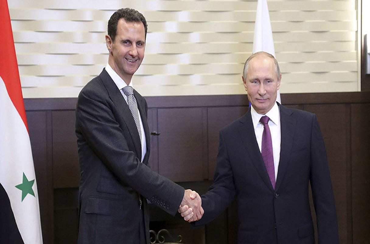 Cai bat tay chien thang cua Tong thong Putin va Tong thong Assad
